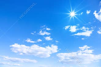 typical beautiful blue sky sun clouds background
