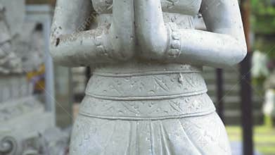 Indonesia god statue in front Bali temple, Indonesia. Traditional indonesian hindu symbol. Ancient sculpture religious