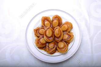 Top view of abalone servings in a fine dining setting