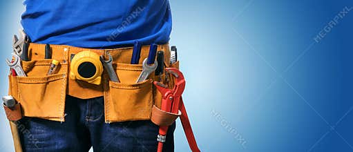 handyman tool belt on blue background with copy space