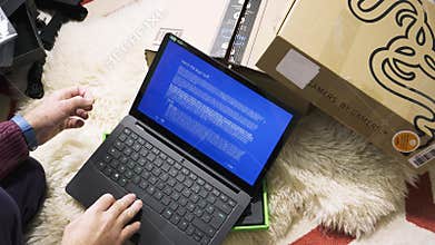 Man unboxing new gamer Razer Blade Stealth laptop sent by Amazon windows 10 installations