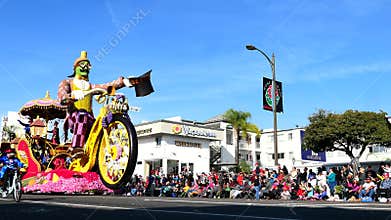 Big fun man riding bicycle, Showmanship Award float in the famous Rose Parade