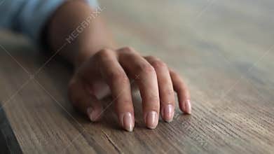 Female Fingers Tapping on the Table