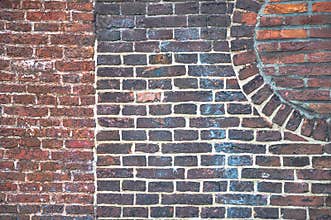 Detail from an old brick wall with different patterns visible