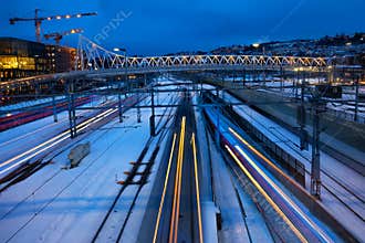 Trains speeding along tracks
