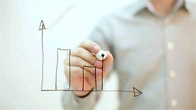 Growth Graph. Man draws on transparent screen