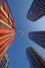 Business buildings and airplane, China