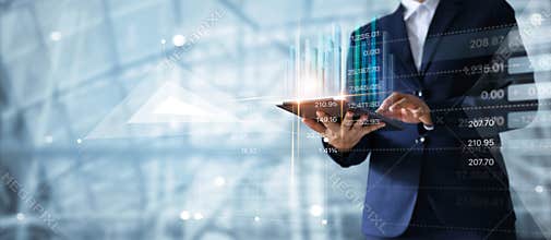 Businessman using tablet analyzing sales data growth graph