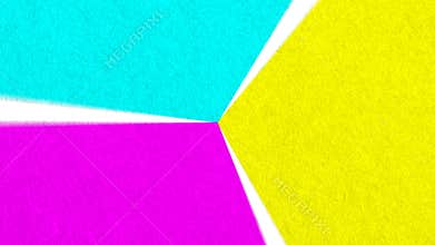 Purple yellow & teal paper spinning in a rotating wheel of textured color rough paper triangle shapes with seamless loop