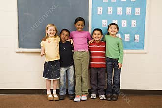 Students Standing in Classroom.
