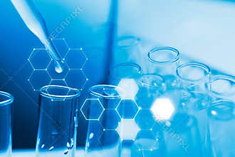 Dropping chemical liquid to test tube, laboratory research and development concept