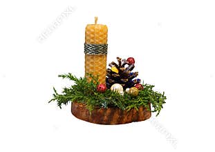 A Christmas candle in the exposition with a pine cone and juniper twigs on a cherry cut. PNG.