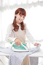 Young Asian women to the ironing
