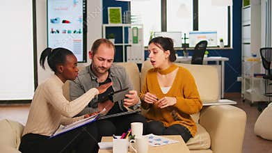 Diverse businesspeople analysing financial project during corporate meeting