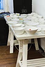 Stoneware dishes in a ceramics artists home pottery studio