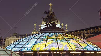 Glass cupola crowned by a statue of Saint George, patron of Moscow, at the Manege Square timelapse in Moscow, Russia