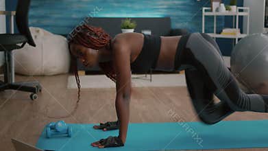 Athletic slim black woman doing run exercise during morning fitness workout