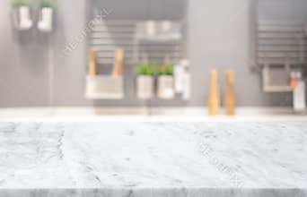 Selective focus,Marble table top on blur white kitchen room background.F