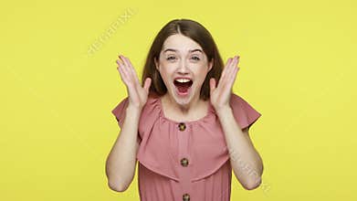 Excited woman with brown hair opening her mouth in amazement