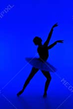 Beautiful silhouette of ballerina on blue background dancing ballet. Woman performs smooth movements. Sensual dancer in