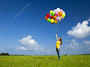Girl with colorful balloons
