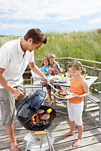 Family having burgers off the grill
