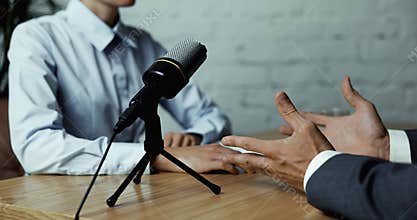 podcast interview recording - radio host discussion with businessman in broadcasting studio