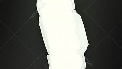 White Menstruation and sanitary napkin pad is rotating on black background. Feminine hygiene product