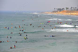 The view of surfers waiting for the big waves near Huntingdon Beach, California, U.S.A
