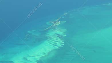 Flying over The Bahamas. Beautiful ocean colors. Actual aerial footage.