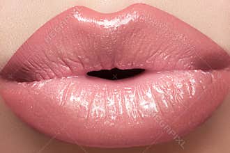 Cosmetics, gloss make-up. Macro fashion lips kiss