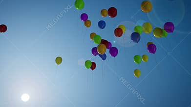 Balloons Rising Against A Blue Sky Footage