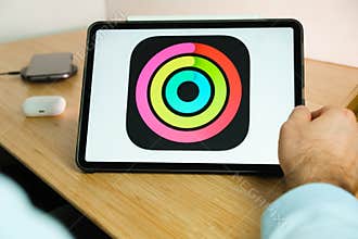 Apple fitness logo on the screen of iPad tablet. March 2021, San Francisco, USA