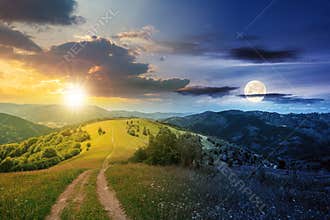 day and night time change concept above road through meadow in mountains