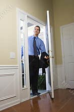 Businessman coming home.