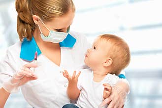 Doctor does injection child vaccination baby