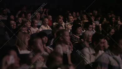 Children watching a show at the theatre 1.