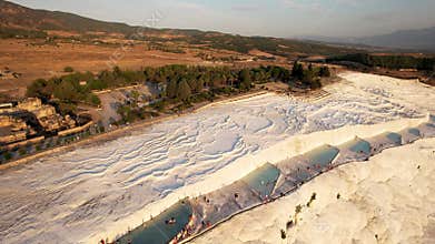 Aerial view of the travertines in Pamukkale, Turkey. White limestone mineral formations.