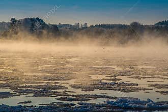 Scenic nature landscape of winter river and ice flowing