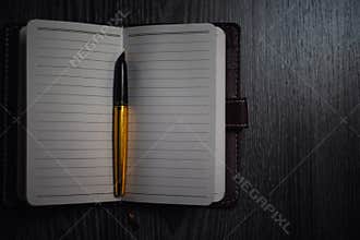 Subject shooting - Notepad and gold pen