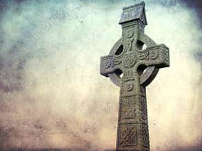Celtic cross isolated on a grunge textured background