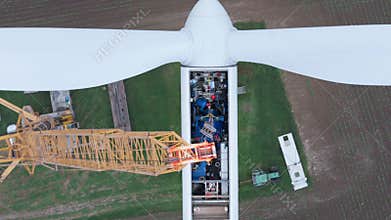 Wind turbine repaired by workers, maintenance of turbine