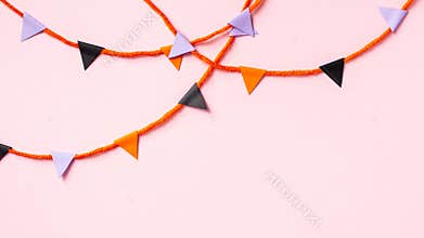 Halloween bunting flag garland on pink background
