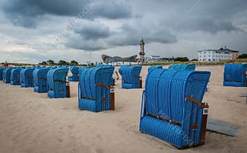 Hooded beach chairs on German beach.
