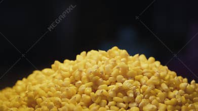 Pile of boiled corn kernels for selling at food market