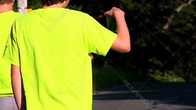 Triathlon runners pass water station; 7
