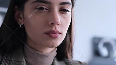 Close Up Portrait Of A Contemplating Woman Employee