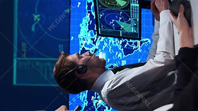 Workplace of the air traffic controllers in the control tower. Team of professional aircraft control officers works