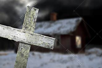 Old shack and wooden cross