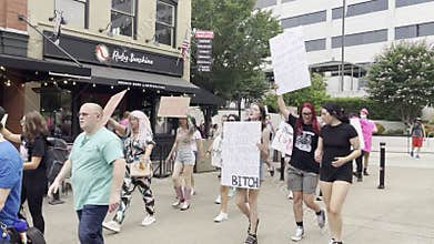 Horizontal Video of Pro Choice Rally w Sound - Group Marching and Chanting for Women\'s Rights